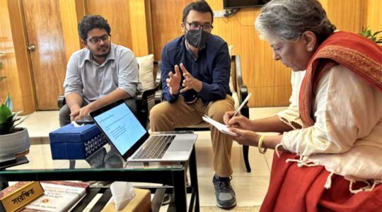 Ehsan (center) explains responsible AI fundamentals to the Hon. Sharmeen Murshid (right), the leader of Bangladesh’s Ministry of Social Welfare.