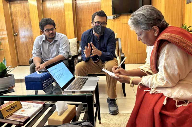 Ehsan (center) explains responsible AI fundamentals to the Hon. Sharmeen Murshid (right), the leader of Bangladesh’s Ministry of Social Welfare.