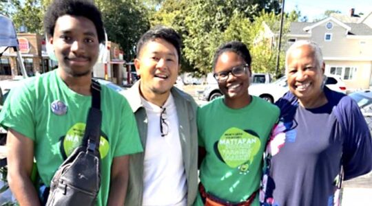 Herman Saksono (second from left) and Vivien Morris (right) along with other members of the Mattapan Food and Fitness Coalition