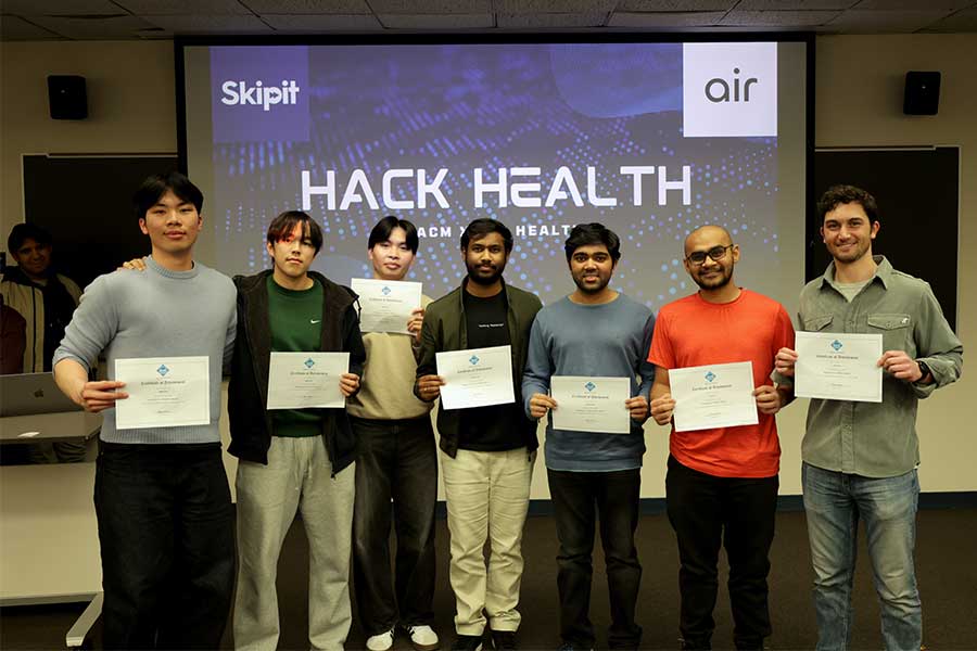 Seven winner at a student-led hackathon hold up their award certificates